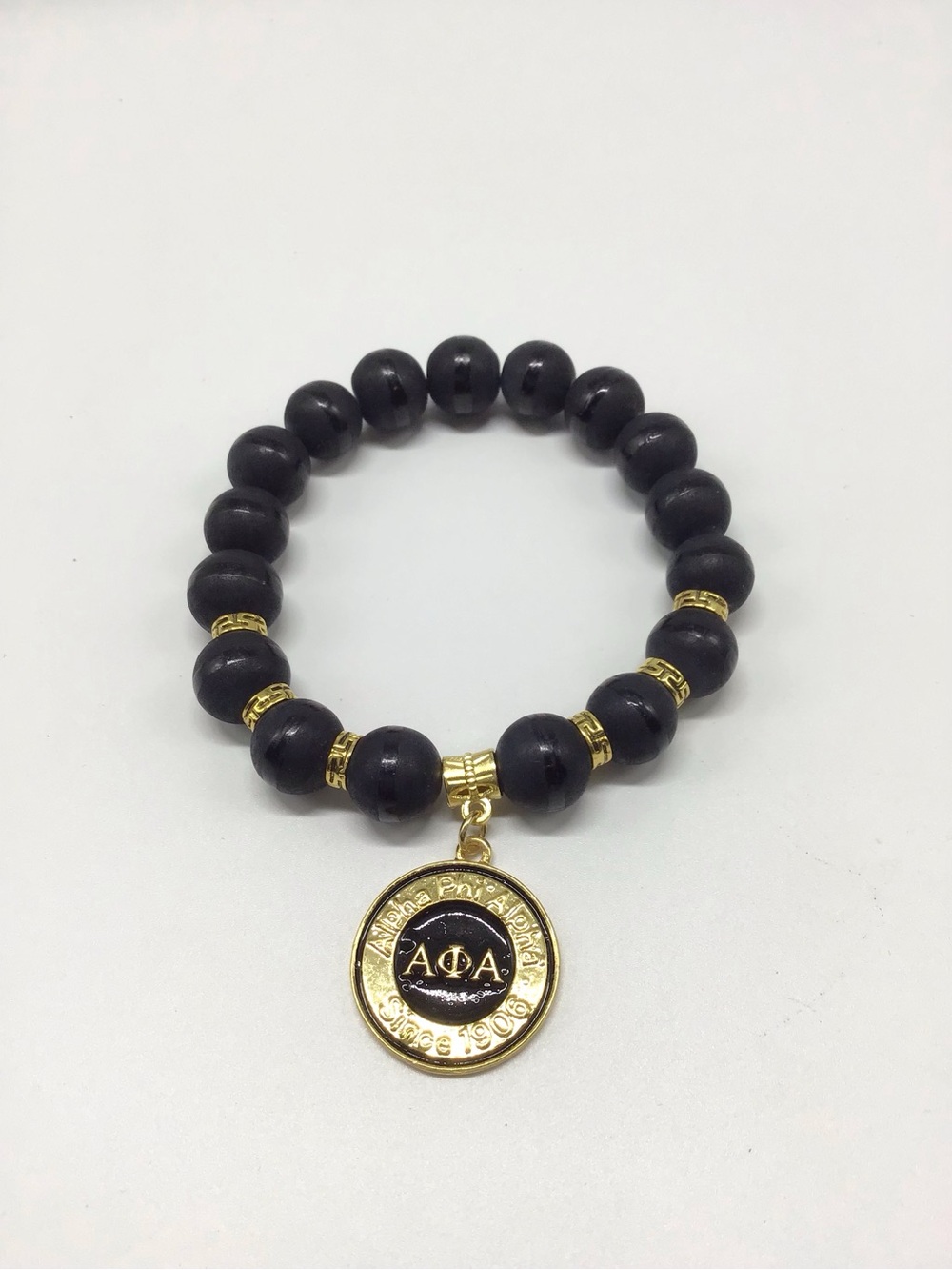 Alpha Phi Alpha Black Beaded Bracelet with Gold Charm
